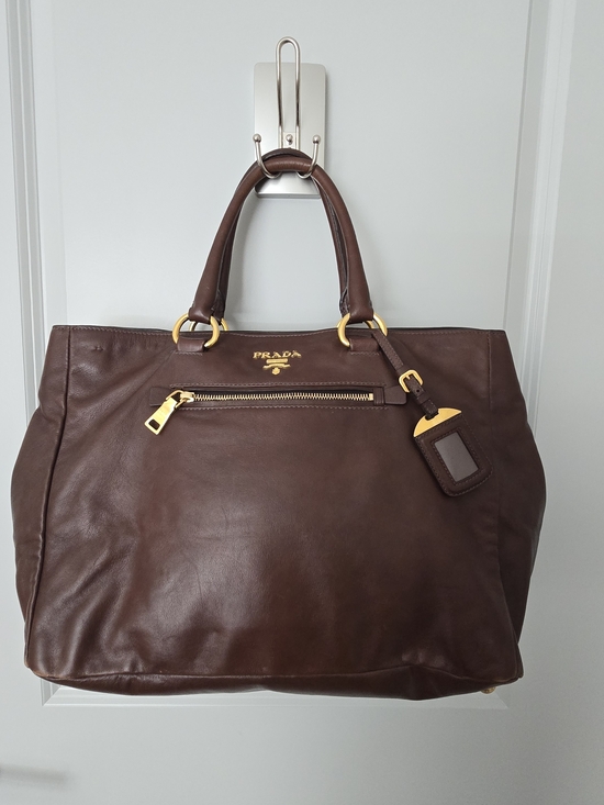 Prada Handbags - Prada Dark Brown Leather Duffel Bag with Gold Hardware